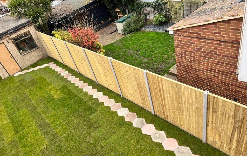 Closeboard fencing with new turf and path